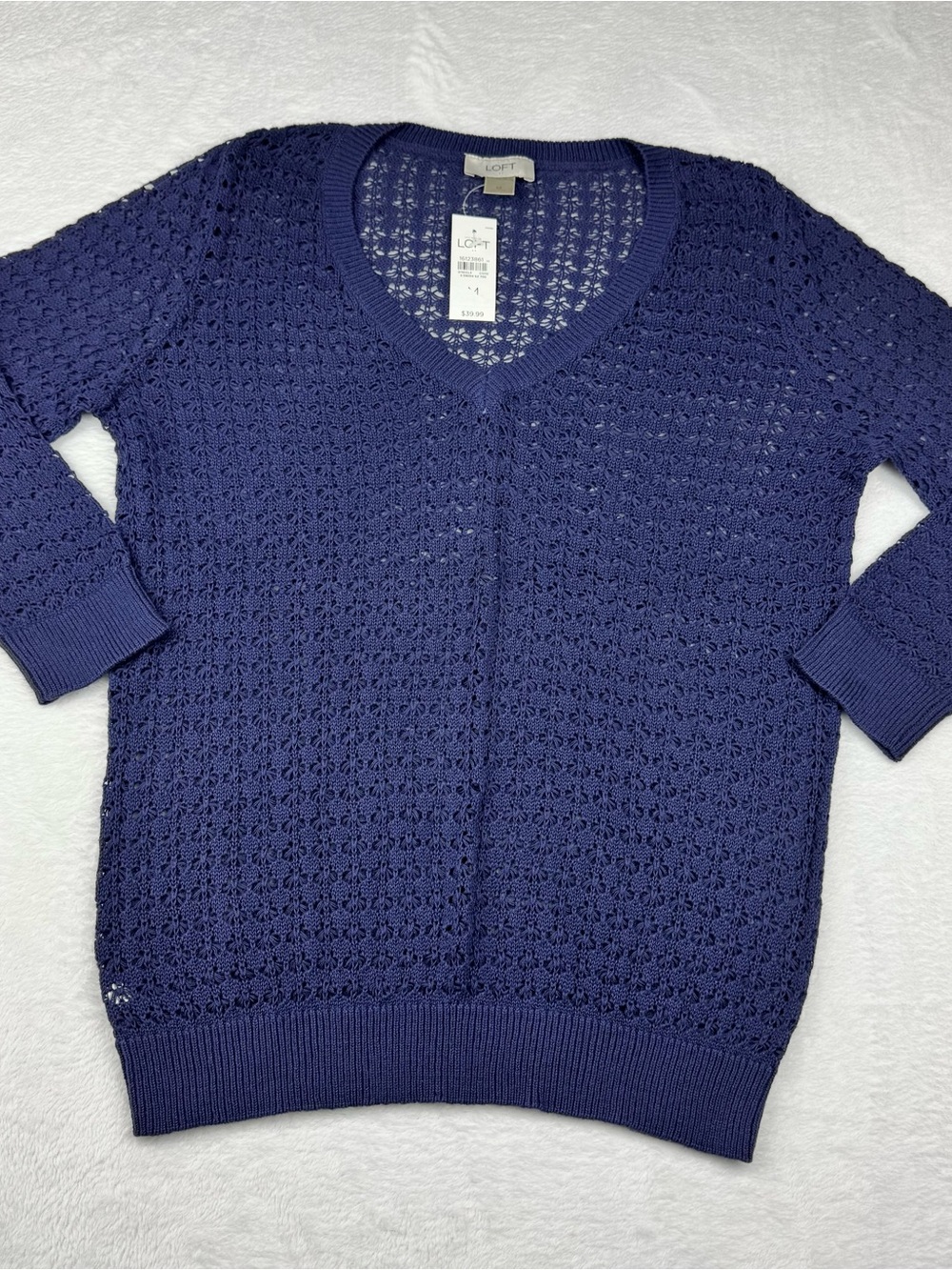 Ann Taylor Loft NWT sweater with an airy, open-knit. 3/4 length sleeves. Size M.